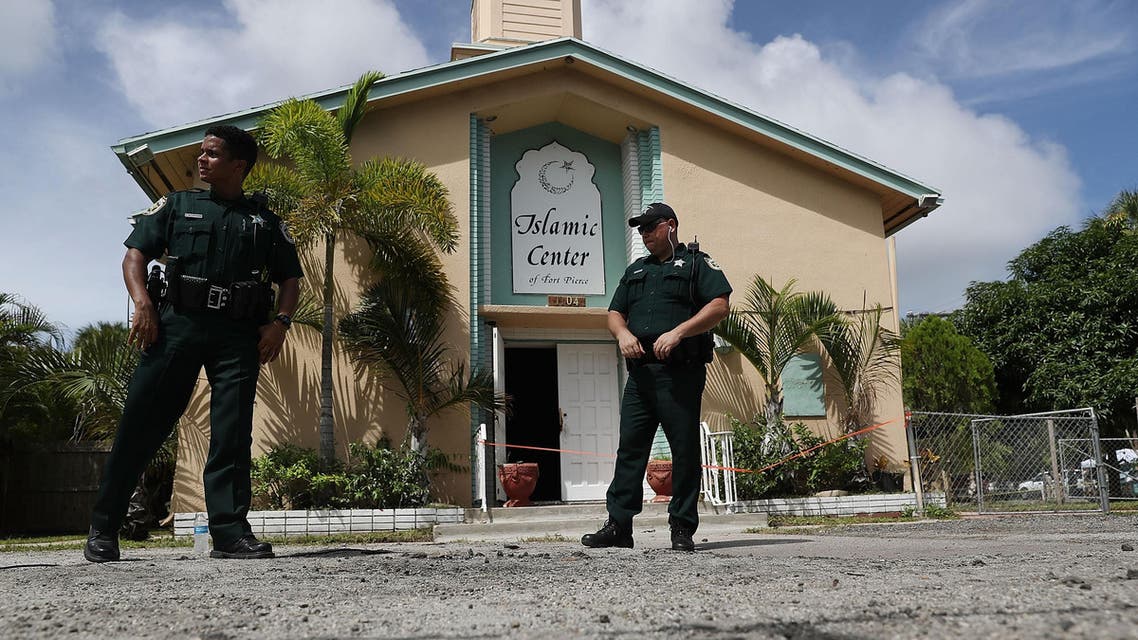 FORT PIERCE, FL - SEPTEMBER 12: Law enforcement officials investigate a fire at the Islamic Center of Fort Pierce, which was the mosque attended by the Pulse nightclub gunman, who killed 49 people in Orlando on September 12, 2016 in Fort Pierce, Florida. Law enforcement officials are investigating the fire as an arson and say that surveillance cameras show a person approaching the mosque moments before the blaze on Monday morning. Joe Raedle/Getty Images/AFP JOE RAEDLE / GETTY IMAGES NORTH AMERICA / AFP