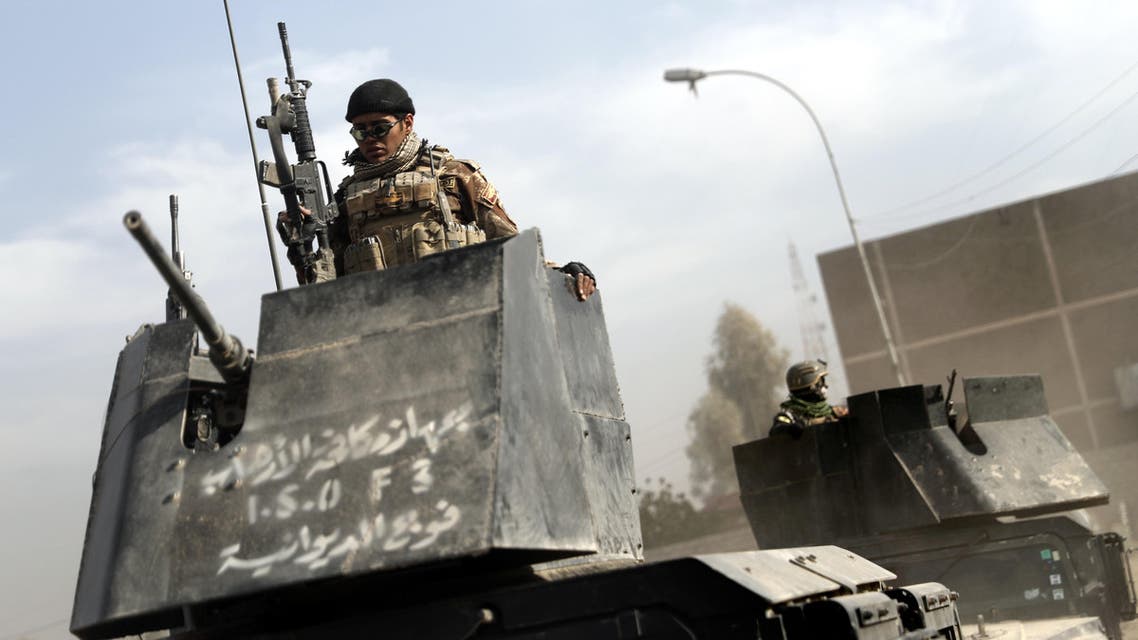 An Iraqi girl, displaced with her family from their village of Tal Um Jadaan, southwest of Mosul, arrive in an area near Qayyarah on November 26, 2016, during an ongoing operation against Islamic State (IS) group jihadists. Iraqi forces battling the Islamic State group deep inside Mosul were urged by the International Rescue Committee to create safe exits for residents. Since the October 17 start of a broad offensive to retake Mosul, Iraqi forces have already recaptured several eastern neighbourhoods despite fierce jihadist resistance. AHMAD AL-RUBAYE / AFP