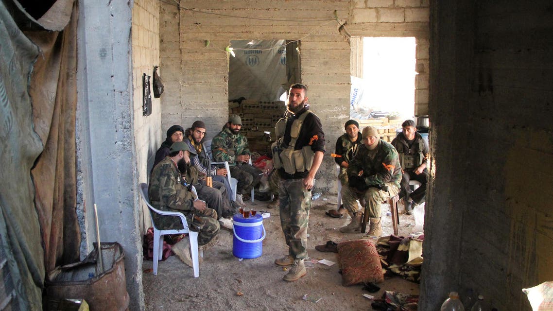 Rebel fighters from the Jaish al-Fatah (or Army of Conquest) brigades have a tea in a building under construction on October 29, 2016 in the neighbourhood of Dahiyet al-Assad, southwest of Aleppo, after they retook control of the area. Syrian rebels launched a major assault on October 28, 2016 aimed at breaking a months-long siege of opposition-held districts of Aleppo, as regime ally Russia held off on renewed air strikes. Control of the city, divided between the rebel-held east and the west in the hands of President Bashar al-Assad's forces, is key to securing northern Syria. Omar haj kadour / AFP