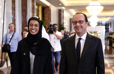 French President Francois Hollande (R) meets with Emirati State Minister to the United Arab Emirates' Federal National Council, Noura al-Kaabi, upon his arrival on December 2, 2016 in Abu Dhabi. afp