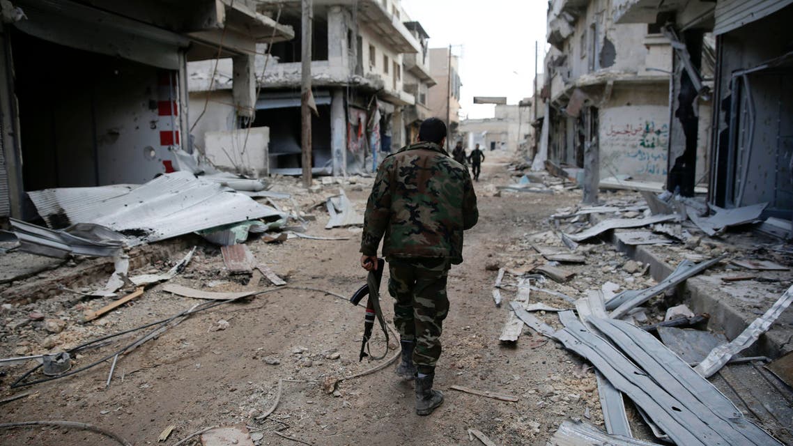 Syrian army soldiers patrol the east Aleppo neighborhood of Tariq al-Bab, Syria, Saturday, Dec. 3, 2016. Tariq al-Bab was captured by Syrian government forces on Friday. (AP Photo/Hassan Ammar)