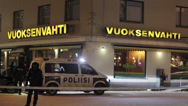 Police guards the area where three people were killed in a shooting incident at a restaurant in Imatra, eastern Finland, after midnight on December 4, 2016. إطلاق نار في فلندا ايماترا على حدود روسيا