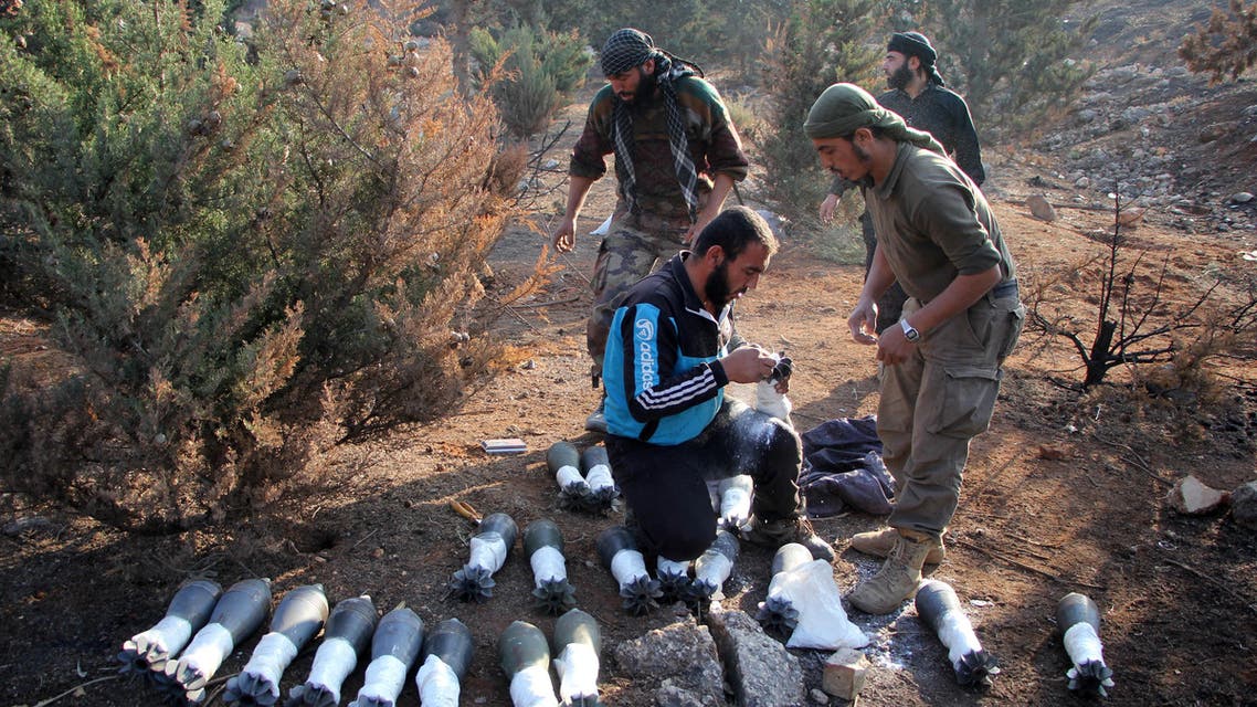 Rebel fighters from the Jaish al-Fatah (or Army of Conquest) brigades prepare mortar shells towards western government-controlled districts on October 30, 2016 at an entrance to Aleppo, in the southwestern frontline neighbourhood of Dahiyet al-Assad, on the third day of a rebel offensive to break a three-month siege of the opposition-held east of Syria's second city. Rebel groups have pledged to push from newly captured positions in the Dahiyet al-Assad district towards Hamdaniyeh. Rebels and allied jihadists launched a major offensive on October 28, 2016 to break through government lines and reach the 250,000 people living in the city's east. 