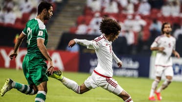 Iraqi's Saad Luaibi (L) vies for the ball with UAE's Omar Abdulrahman during the 2018 World Cup qualifying football match between Iraq and the United Arab Emirates at Sheikh Mohammed Bin Zayed stadium in Abu Dhabi on November 15, 2016.  Karim Sahib / AFP