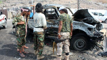 Yemeni loyalist forces gather at the scene of a suicide attack targeting the police chief in the base of the Saudi-backed government on April 28, 2016 in Yemen's second city Aden. AFP