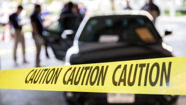 caution tape or police line protect vehicle in crime scene investigation training in academy with blurred law enforcement background. shutterstock