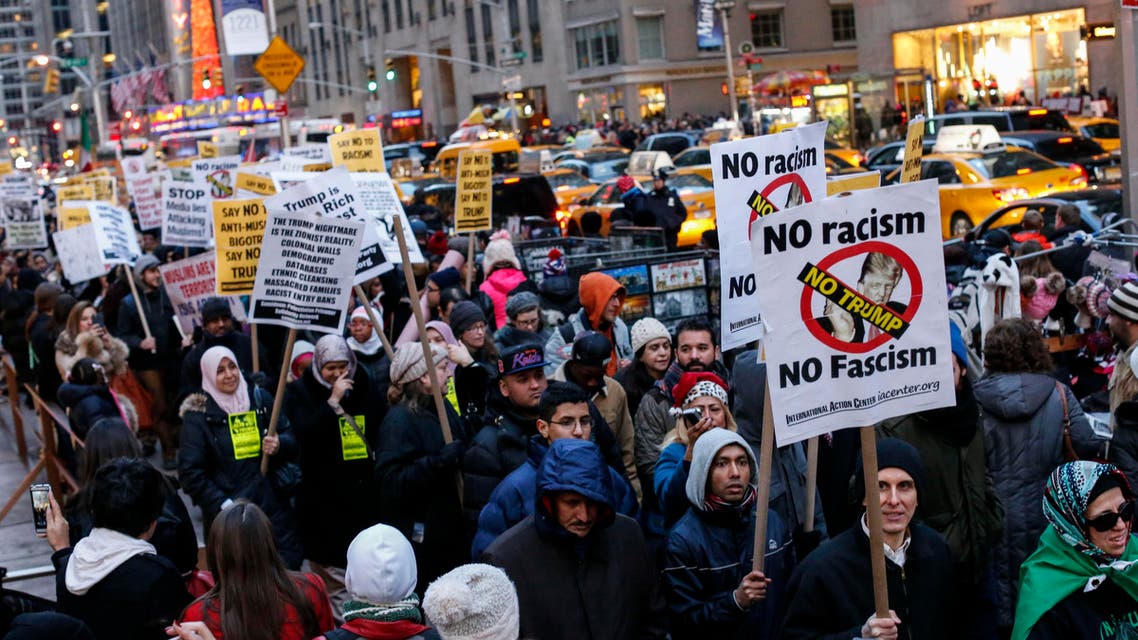 People take part in a protest against Donald Trump on December 20, 2015 in New York. Republican presidential hopeful Donald Trump proposed a call for a ban on Muslims entering the United States. AFP PHOTO/KENA BETANCUR KENA BETANCUR / AFP