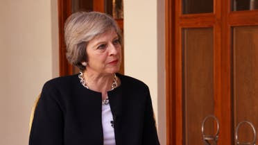 UK PM Theresa May talks to Turki al-Dakhil (Al Arabiya News)