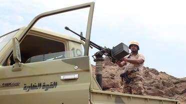 A Yemeni fighter loyal to President Abedrabbo Mansour Hadi stands on an armed pick up truck near Kahbub, on a mountainous area overlooking the strategic Bab al-Mandab Strait at the entrance to the Red Sea, on September 15, 2016. 