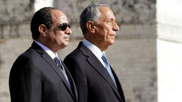 Portuguese President Marcelo Rebelo de Sousa (R) and his Egyptian counterpart Abdel Fattah al-Sisi listen to the national anthems at the Belem monastery on the beginning of the state visit in Lisbon, on November 21, 2016. JOSE MANUEL RIBEIRO / AFP