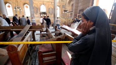 A nun cries as she stands at the scene inside Cairo's Coptic cathedral, following a bombing, in Egypt December 11, 2016. (Reuters)
