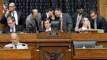 House Foreign Affairs Committee Chairman Rep. Ed Royce, R-Calif., center, and the committee's ranking member Rep. Eliot Engel, D-N.Y., second from right, listen to staffers as they confer on Capitol Hill in Washington, during the committee's hearing on Iran. (AFP)