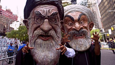Protesters dressed as Ali Khamenei (L), Iran's Supreme leader, and Hassan Rouhani, Iran's President join Iranian Americans in support of the National Resistance of Iran at a rally in Dag Hammerskjold plaza September 20, 2016 near the United Nations in New York. (AFP)