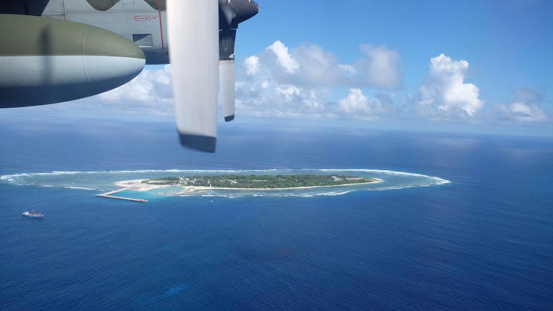 An aerial view shows a Taiwan Coast Guard vessel preparing for a search-and-rescue exercise off Taiping island, in the South China Sea. AP