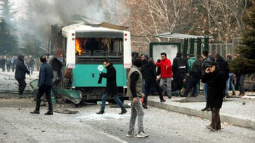 People react after a bus was hit by an explosion in Kayseri, Turkey, December 17, 2016. Turan Bulut/ Ihlas News Agency via REUTERS ATTENTION EDITORS - THIS PICTURE WAS PROVIDED BY A THIRD PARTY. FOR EDITORIAL USE ONLY. NO RESALES. NO ARCHIVE. TURKEY OUT. NO COMMERCIAL OR EDITORIAL SALES IN TURKEY. TPX IMAGES OF THE DAY