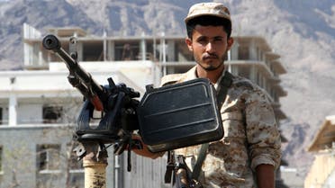 A member of Yemeni security forces stands guard at the site where a suicide car bomb exploded next to the central bank in Yemen's second city Aden on October 29, 2016. (AFP)