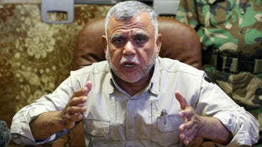 Popular Mobilization Forces commander Hadi al-Amiri speaks to journalists in Nbaie (20 kilometers) of Baghdad, Iraq, Friday, June 12, 2015. ap