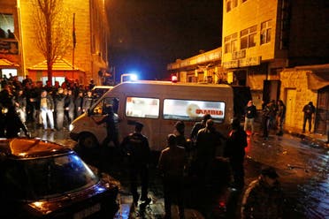 Jordanian policemen and an ambulance are seen in the vicinity of Karak Castle in the city of Karak, Jordan, December 18, 2016. (Reuters)