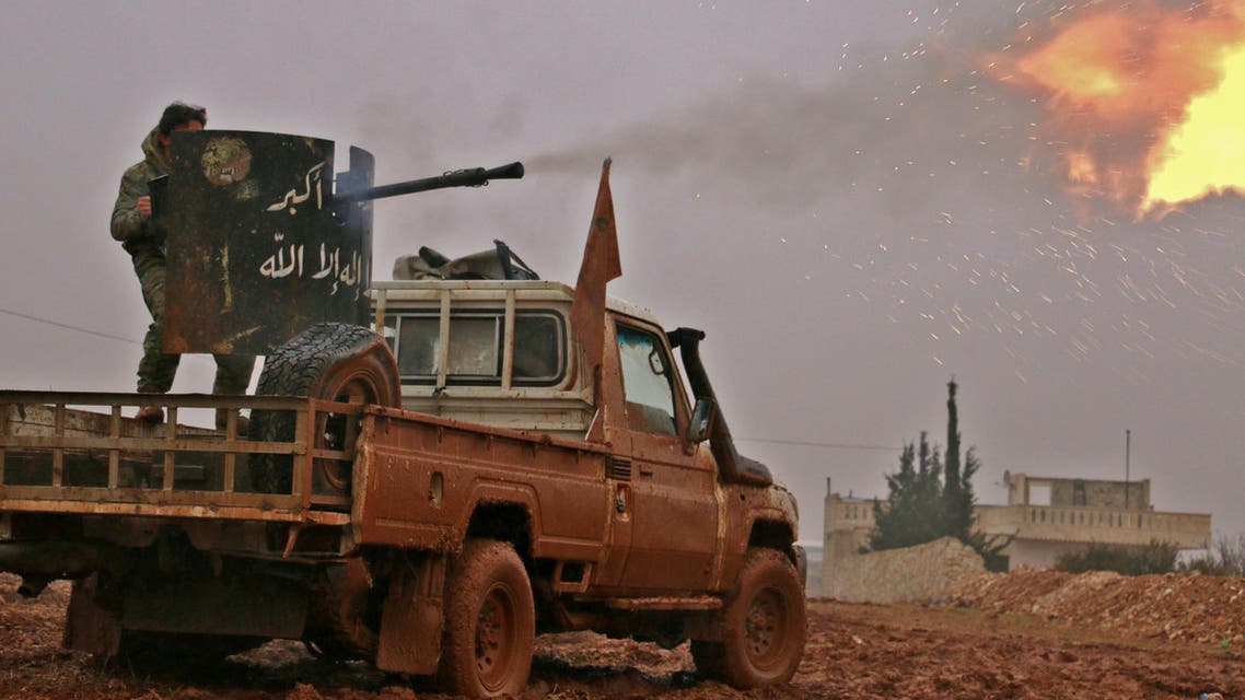 Syrian opposition fighters fire towards positions held by Islamic State (IS) group jihadists in al-Bab on the northeastern outskirts of the northern embattled city of Aleppo on December 13, 2016. (AFP)