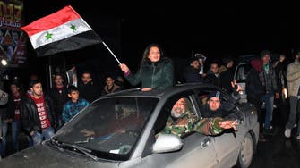 In Aleppo, Assad supporters shout their joy after regime victory 