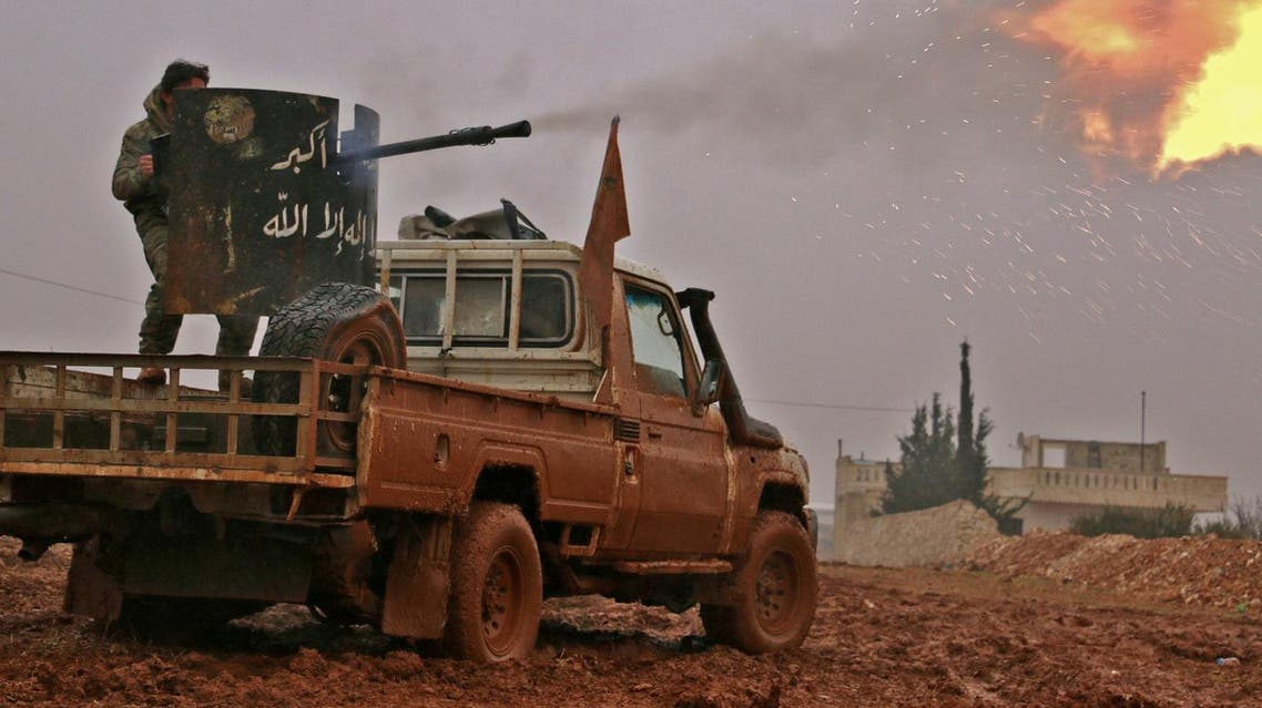 Syrian rebels fire towards positions held by ISIS extremists in al-Bab. (AFP)