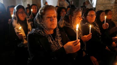Iraqi Christians attend a mass on Christmas eve at the Mar Shemoni church in the town of Bartella east of Mosul, December 24, 2016. (Reuters) 