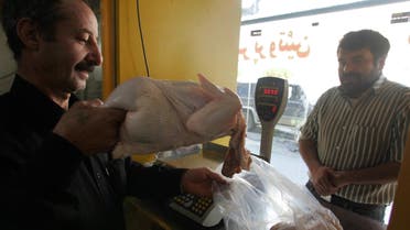 An Iranian man buys fresh chicken in Tehran, 20 January 2008.AFP
