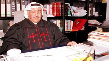 Kuwait's only priest Emanuel Benjamin al-Ghareeb sits in his office at the National Evangelical Church of Kuwait 27 January 2001 in Kuwait City. (AFP)