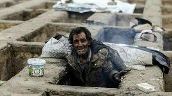 Shocking images emerge of homeless living in Tehran’s graves 