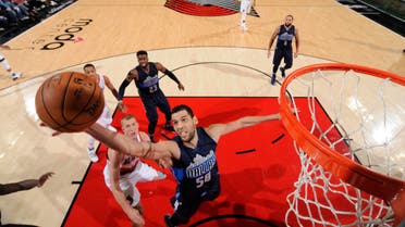 Salah Mejri #50 of the Dallas Mavericks grabs the rebound during a game against the Portland Trail Blazers on December 21, 2016 at the Moda Center in Portland, Oregon. (AFP)