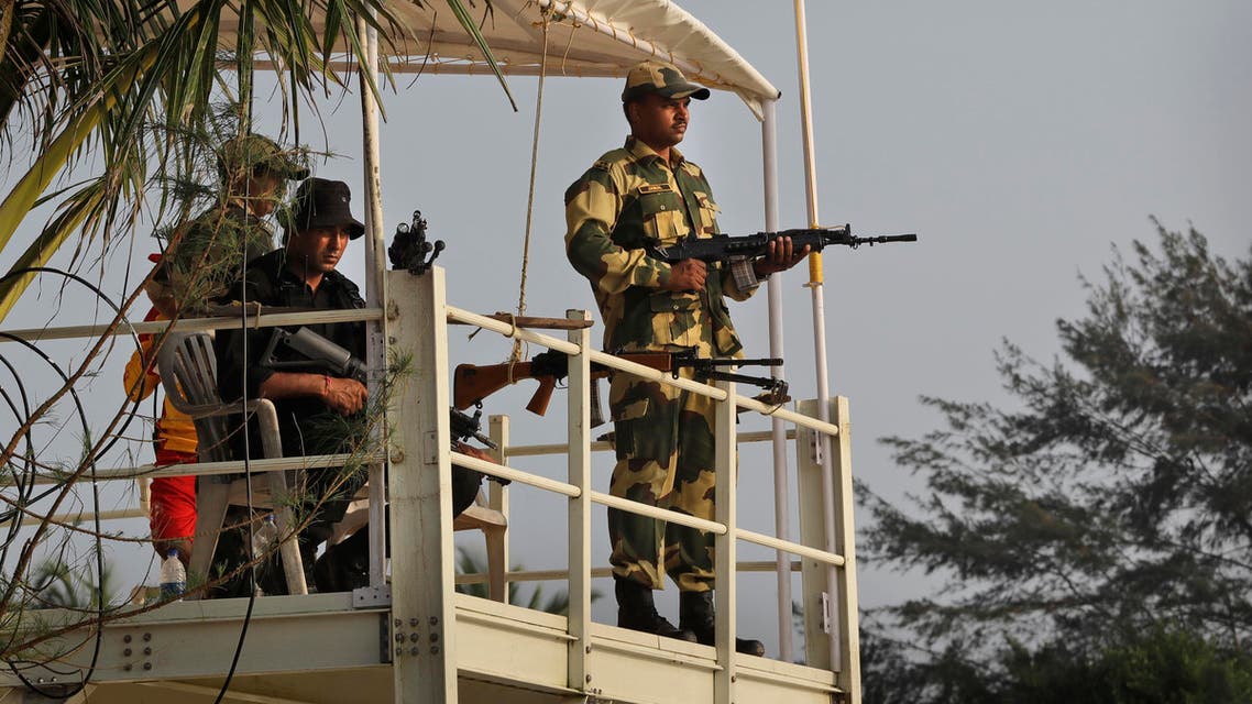 An Indian para military force soldier and a National Security guard commando guard the main venue of BRICS summit in Goa, a beach resort town in the western India, on Oct. 14, 2016. (AP)