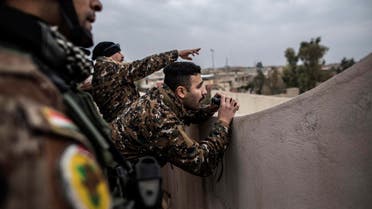 Iraqi members of the Special Forces scan the area held by Islamic state militants from a roof in Mishraq district in Mosul, Iraq, Tuesday, Dec. 20, 2016. Advancing into Mosul has become a painful slog for Iraqi forces. Islamic State group militants have fortified each neighborhood, unlike past battles where they concentrated their defenses in one part of the city. (AP)