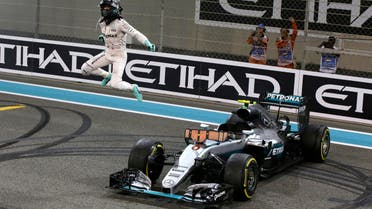  Mercedes driver Nico Rosberg of Germany celebrates after finishing second to win the 2016 world championship during the Emirates Formula One Grand Prix at the Yas Marina racetrack in Abu Dhabi, United Arab Emirates. (AP)