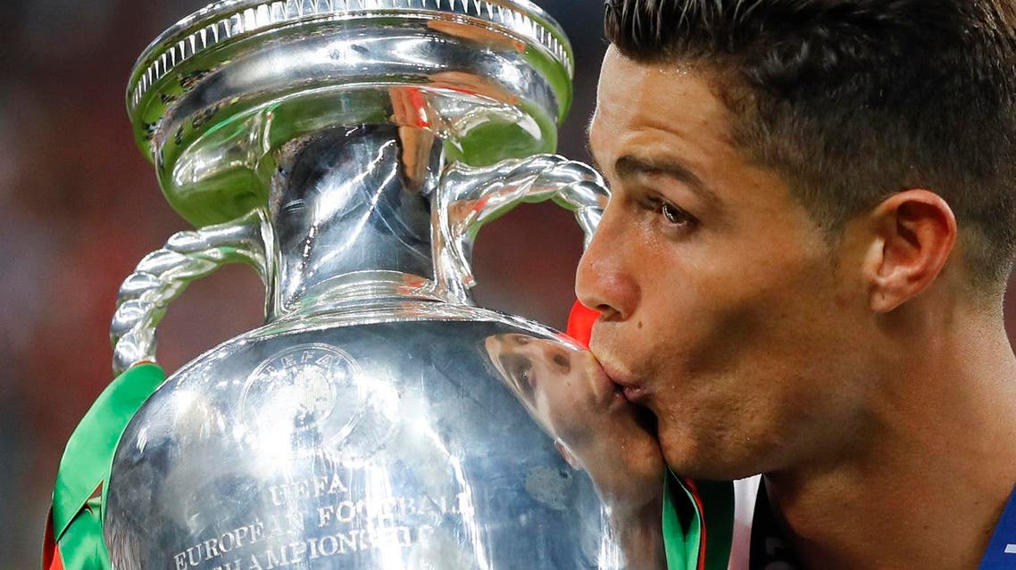 98: Portugal's Cristiano Ronaldo kisses the trophy at the end of the Euro 2016 final soccer match between Portugal and France at the Stade de France in Saint-Denis, north of Paris, on July 10, 2016. (AP)