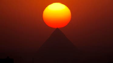 84: The sun sets over the the Giza Pyramids near Cairo, Egypt, on Aug. 19, 2016. (AP)