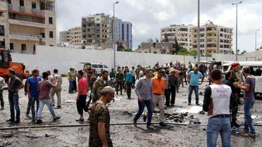 Syrian army soldiers and civilians inspect the damage after explosions hit the Syrian city of Tartous, in this handout picture provided by SANA on May 23, 2016. SANA/Handout via REUTERS ATTENTION EDITORS - THIS IMAGE WAS PROVIDED BY A THIRD PARTY. REUTERS IS UNABLE TO INDEPENDENTLY VERIFY THIS IMAGE. EDITORIAL USE ONLY.