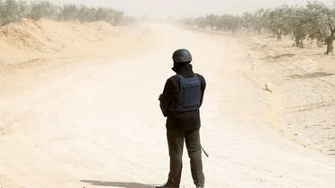 A Tunisian police officer stands guard during an operation to eliminate militants in a village some 50 km (31 miles) from the town of Ben Guerdane, Tunisia, near the Libyan border, March 10, 2016. (Reuters)