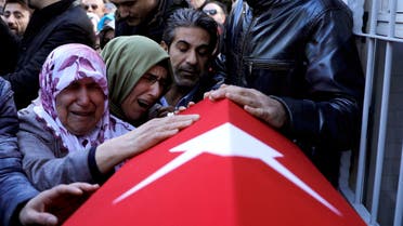 Relatives of Cakmak, a security guard and a victim of an attack by a gunman at Reina nightclub, react during his funeral in Istanbul. (Reuters)