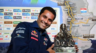 Qatari Nasser Al-Attiyah defended his status as champion of the Dakar Rally on Monday, winning the first stage of the legendary race. (AFP)