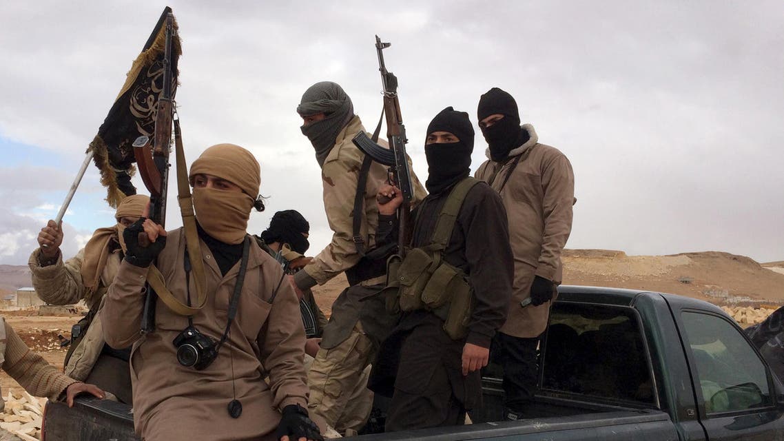 Al Qaeda-linked Nusra Front fighters carry their weapons on the back of a pick-up truck during the release of Lebanese soldiers and policemen in Arsal, eastern Bekaa Valley, Lebanon, December 1, 2015. REUTERS/Stringer
