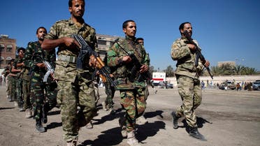 Houthi rebels, dressed in army fatigues, march in a parade during a gathering in the capital Sanaa to mobilize more fighters to battlefronts to fight pro-government forces in several Yemeni cities, on January 1, 2017. (AFP)