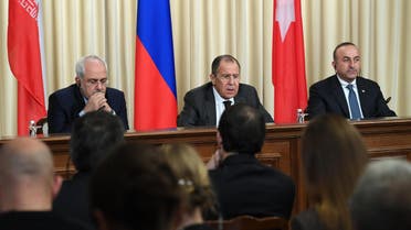 Iranian Foreign Minister Mohammad Javad Zarif, Russian Foreign Minister Sergei Lavrov and Turkish Foreign Minister Mevlut Cavusoglu attend a press conference in Moscow on December 20, 2016. (AFP)