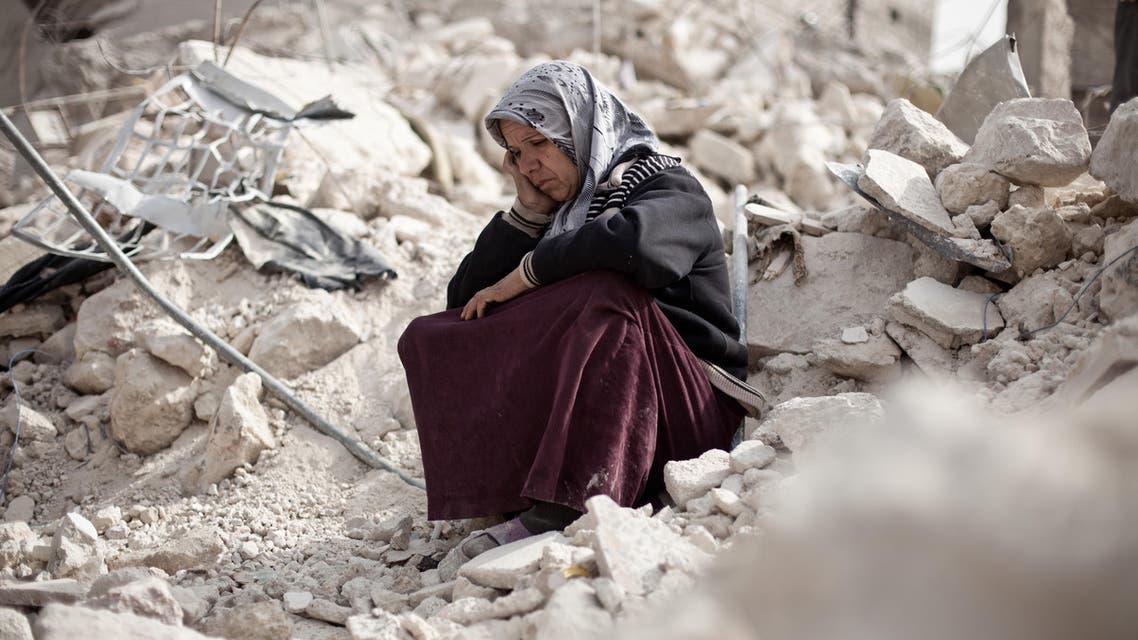 Syrian Zakia Abdullah sits on the rubble of her house in the Tariq al-Bab district of the northern city of Aleppo on February 23, 2013. Three surface-to-surface missiles fired by Syrian regime forces in Aleppo's Tariq al-Bab district have left 58 people dead, among them 36 children, the Syrian Observatory for Human Rights said on February 24. AFP