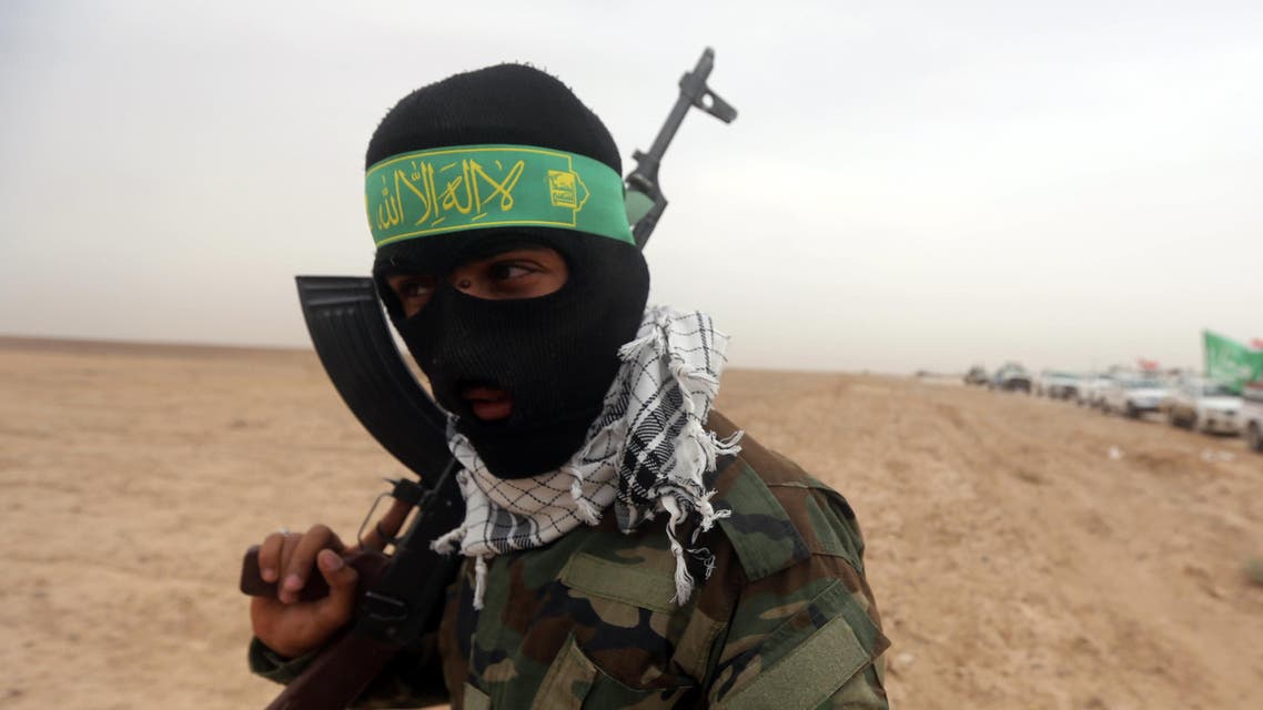 An Iraqi Shiite fighter from the Popular Mobilization units holds a position on the Tharthar frontline on the edge of Anbar province, 120 kms northwest of Baghdad, on June 1, 2015. afp