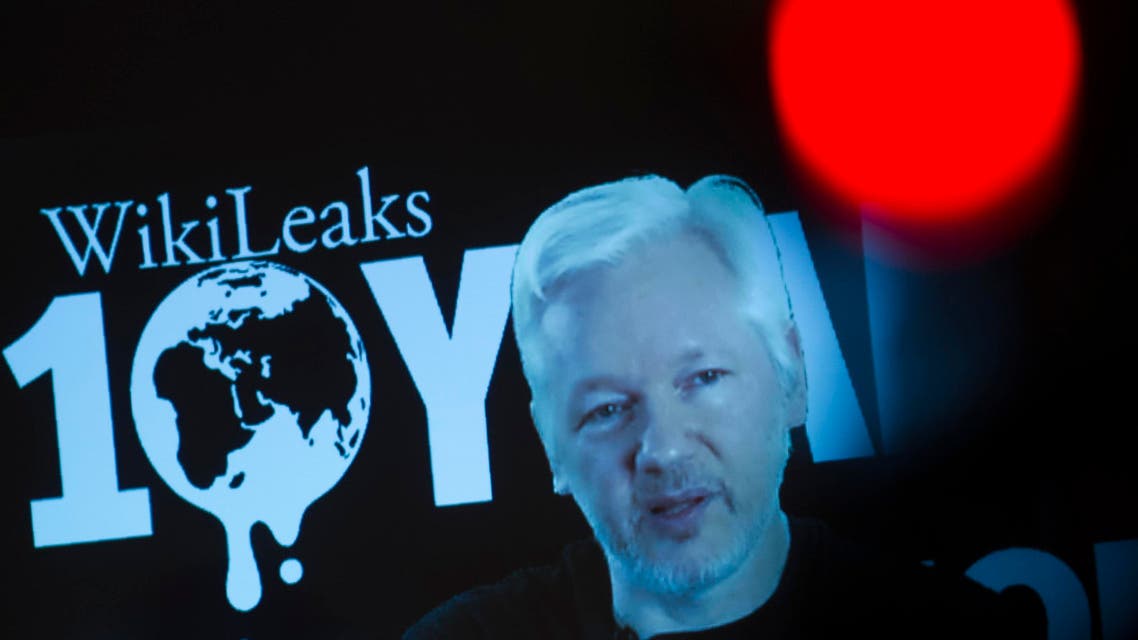 Julian Assange is seen on a screen as he addresses journalists via a live video connection during a press conference on the platform’s 10th anniversary on October 4, 2016 in Berlin. (AFP)