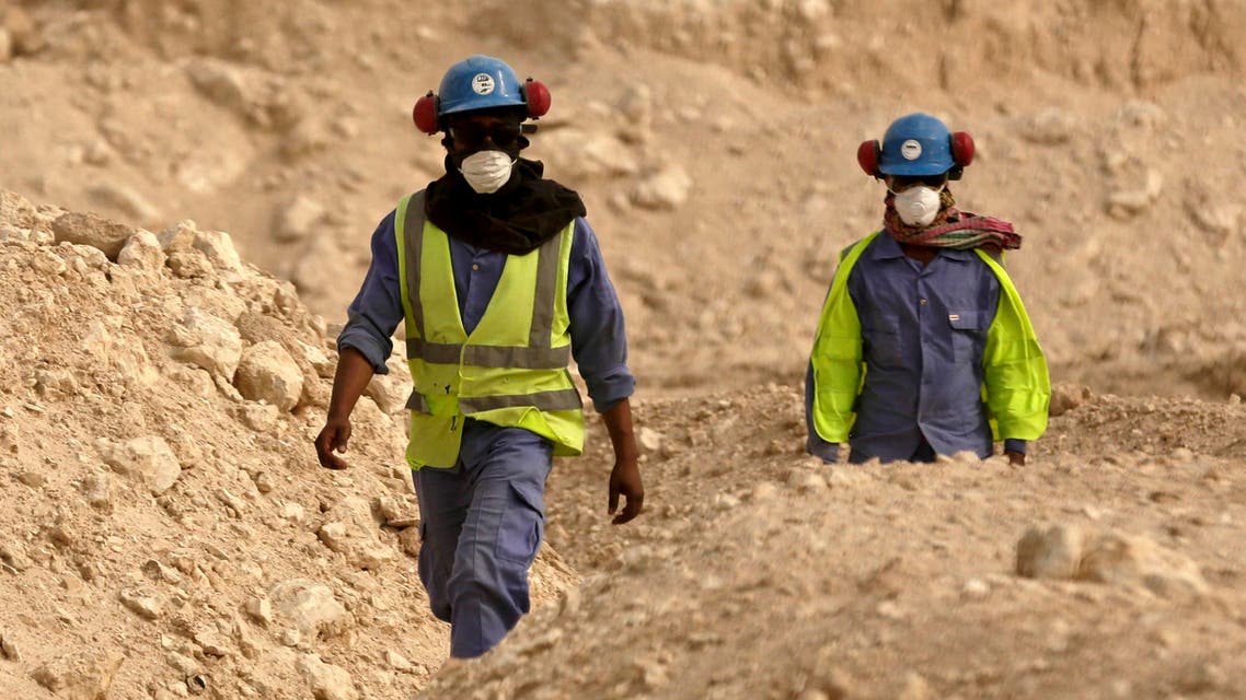 In this file photo taken Monday, May 4, 2015, during a government organized media tour, workers walk back to the Al-Wakra Stadium worksite being built for the 2022 World Cup, in Doha, Qatar. ap