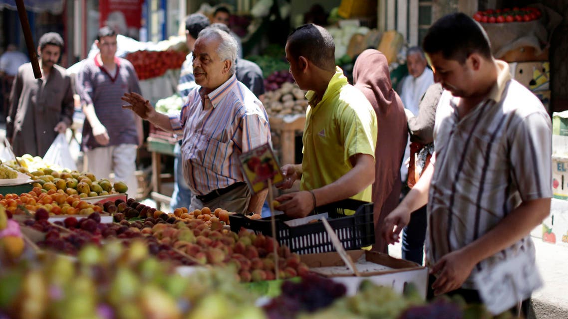 Egyptians shop at a market in Cairo. (AP)