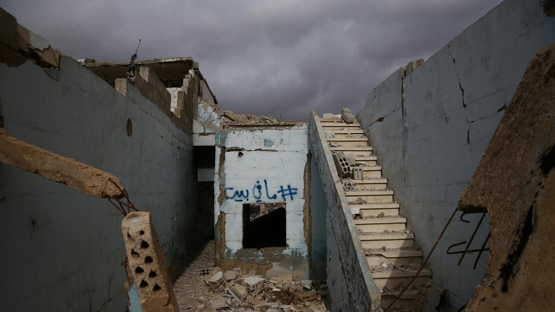 Graffiti reading "there is no house" in Arabic is sprayed on the wall of a damaged house in the rebel held besieged city of Douma, in the eastern Damascus suburb of Ghouta, Syria January 8, 2017. (Reuters)
