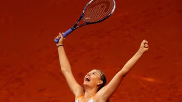 FILE PHOTO - Russia's top seed and holder Maria Sharapova celebrates her victory against China's Li Na in the final of the Stuttgart tennis Grand Prix April 28, 2013. REUTERS/Michael Dalder/File Photo