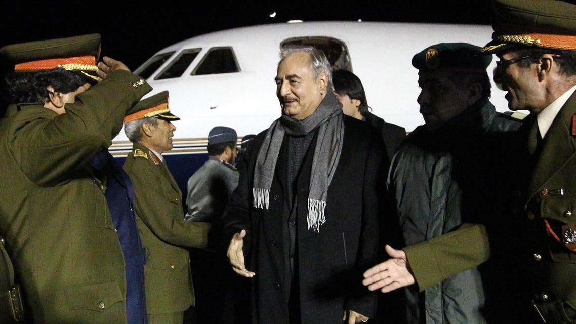 Marshal Khalifa Haftar (C), the military leader of the so-called Libyan National Army and Libya’s parallel parliament based in the eastern city of Tobruk, is greeted upon his arrival at Al-Kharouba airport south of the town of al-Marj, about 80 km east of the Mediterranean port city of Benghazi on December 3, 2016 after his visit in Russia. (AFP)